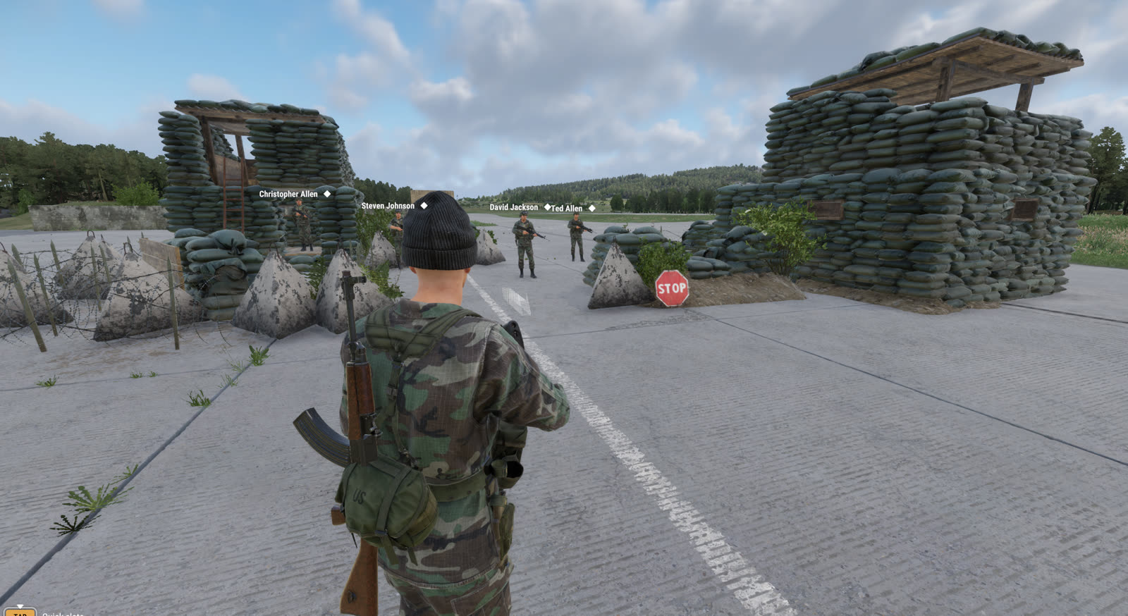 Players holding a sandbagged checkpoint with a stop sign
